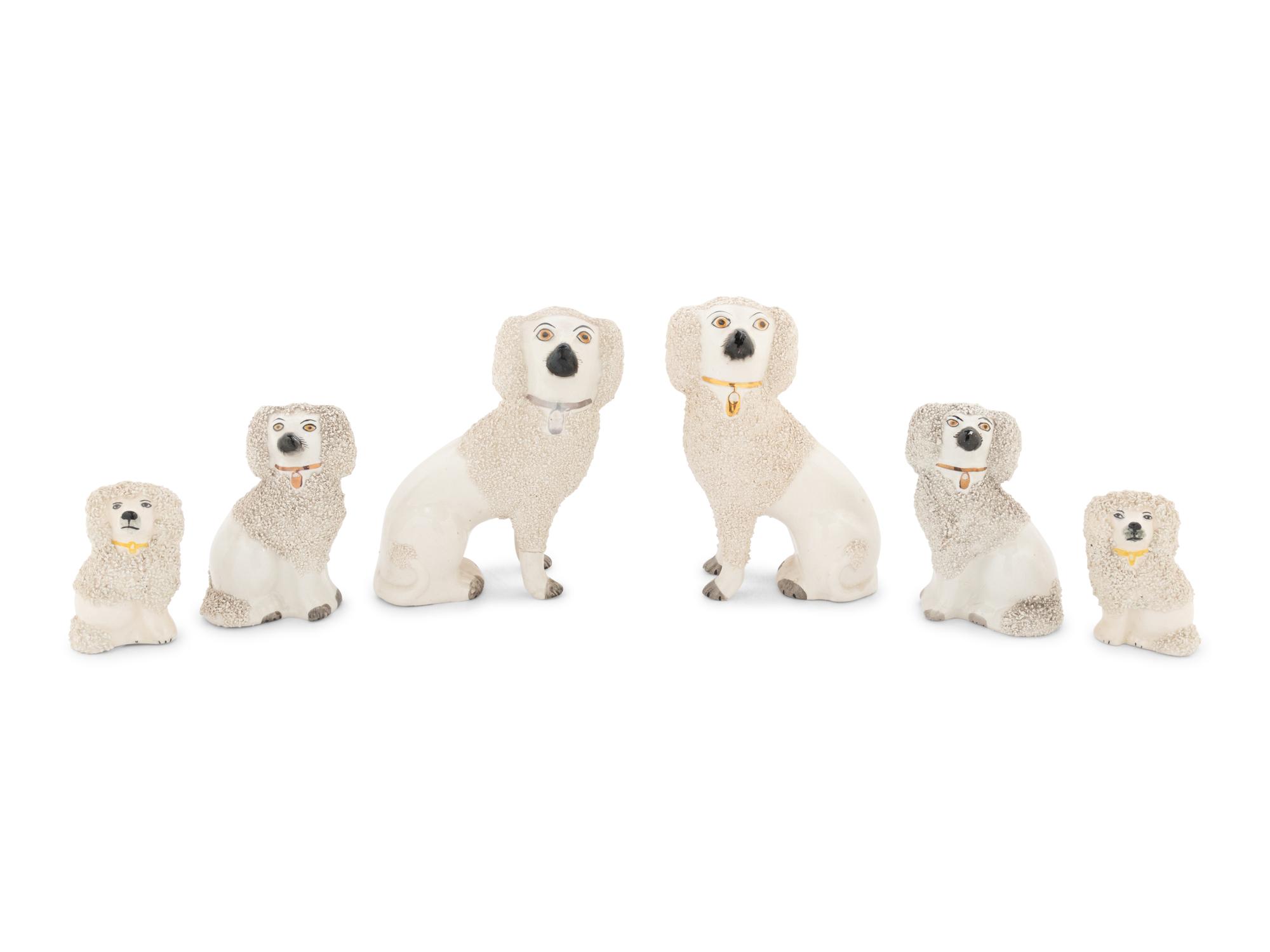 A Collection of Nine Staffordshire Glazed Poodles