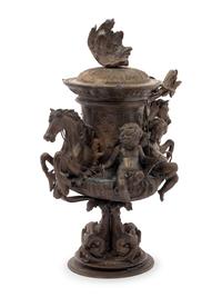 A Continental Cast Metal Urn with Putti and Hippocampi