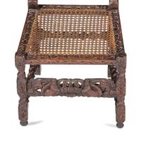 A William and Mary Crown-and-Flower Carved Oak and Cane Upholstered Side Chair