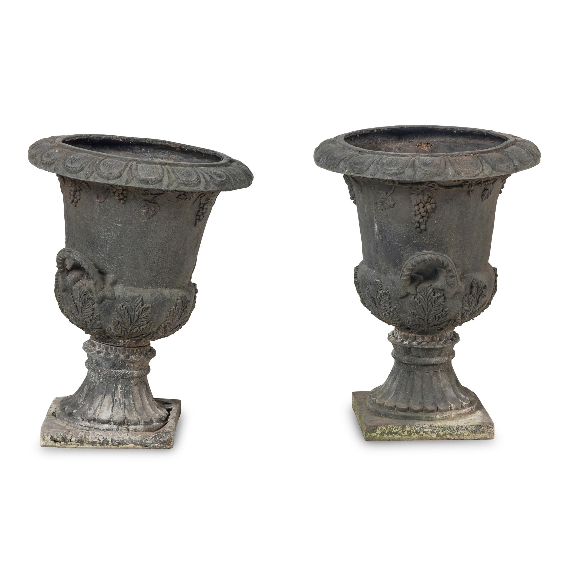 A Pair of Composition Garden Urns