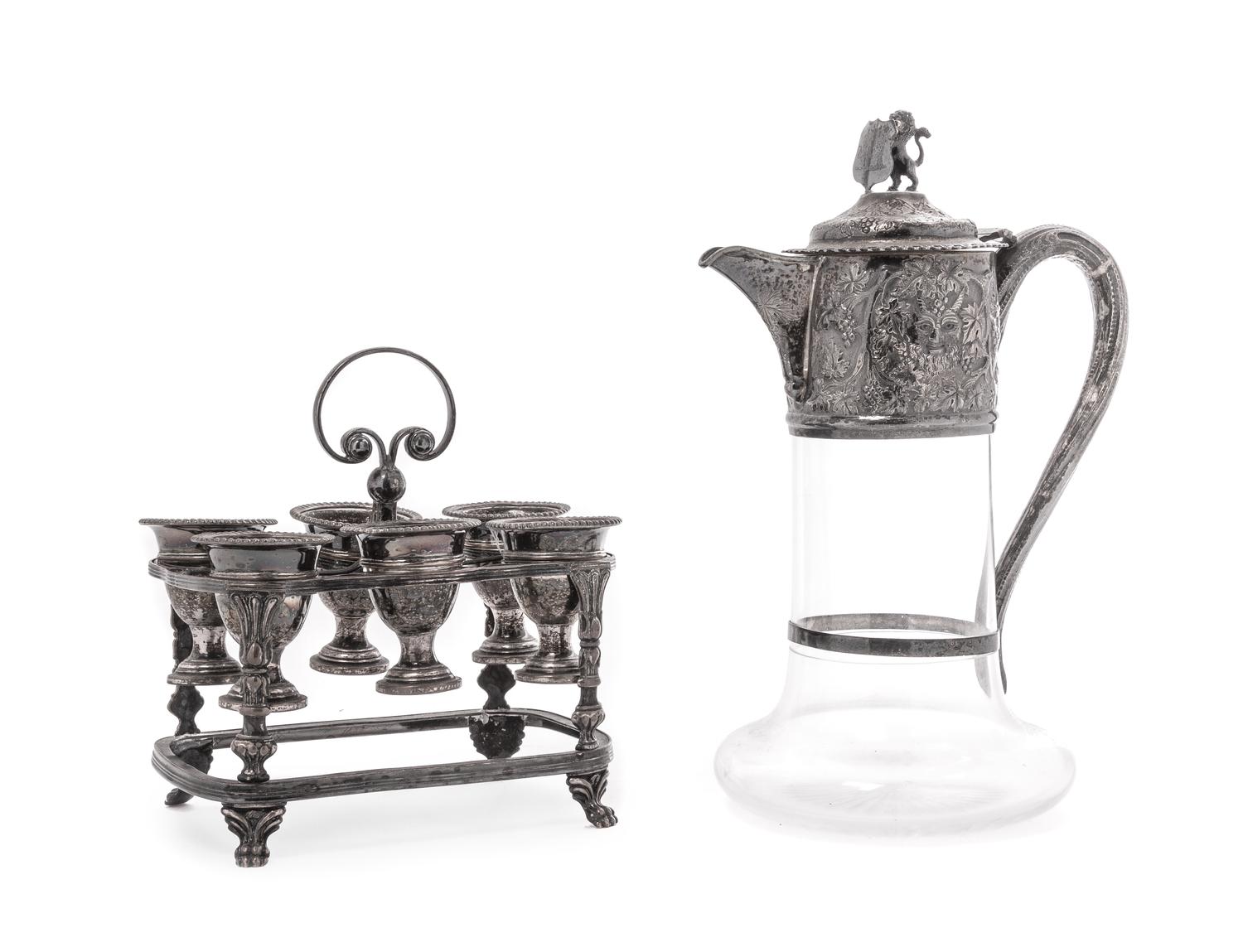 A Victorian Silver Mounted Glass Claret Jug, Charles Boyton, London, 1886, the neck mount having chased Bacchanalian masks and grape vi