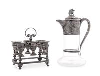 A Victorian Silver Mounted Glass Claret Jug, Charles Boyton, London, 1886, the neck mount having chased Bacchanalian masks and grape vi