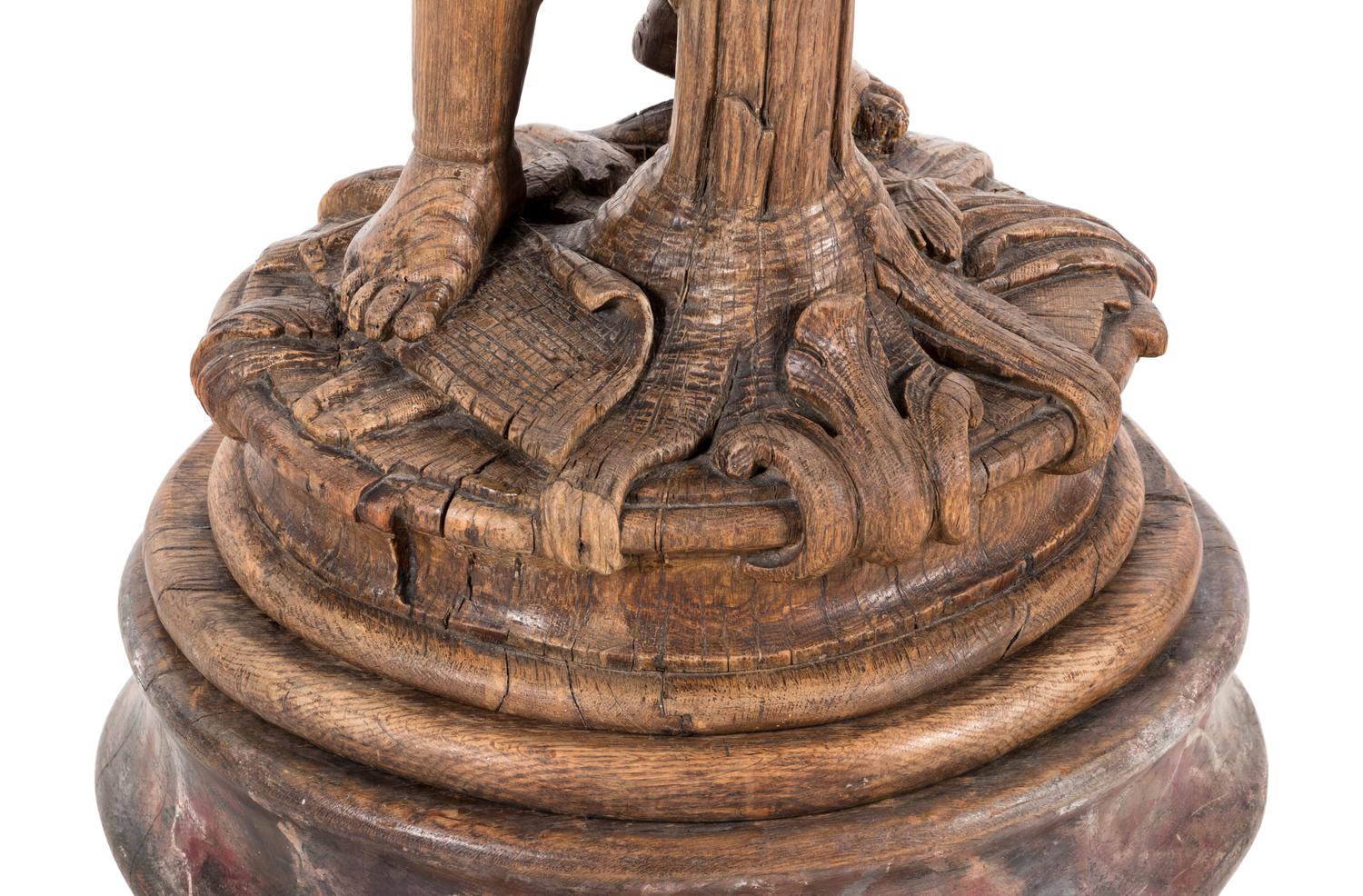 A Continental Carved Oak Figural Pedestal