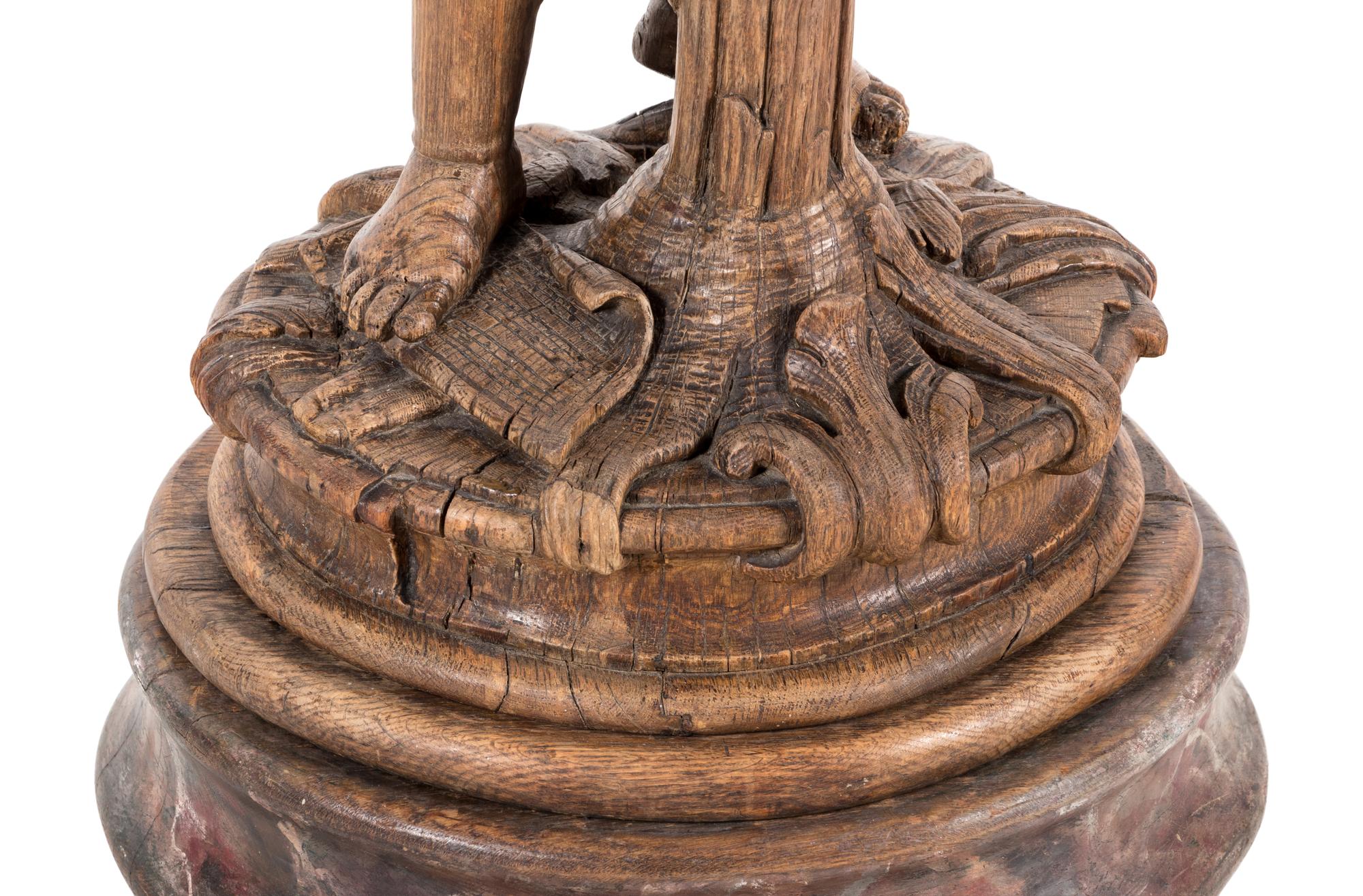 A Continental Carved Oak Figural Pedestal
