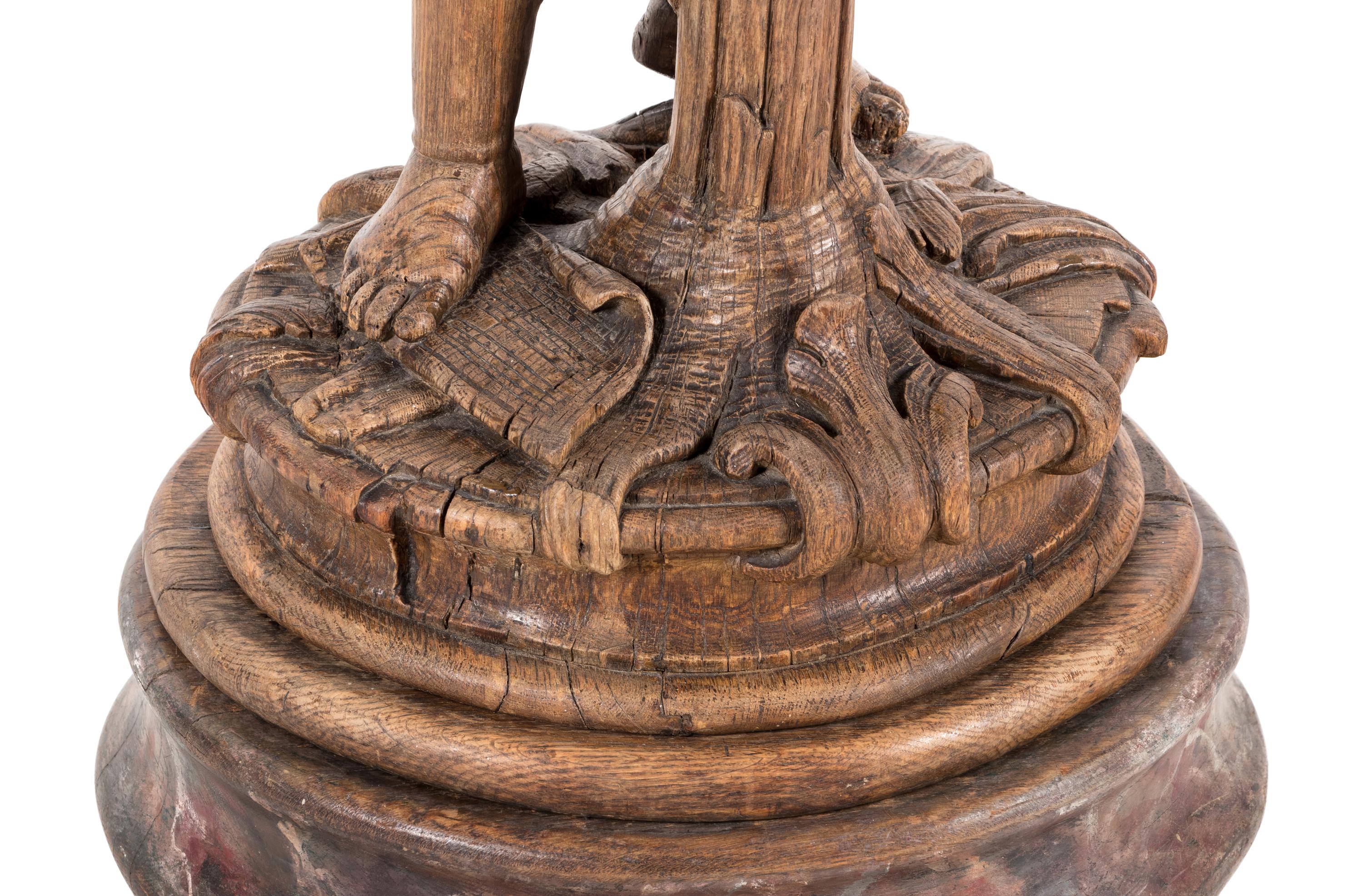 A Continental Carved Oak Figural Pedestal