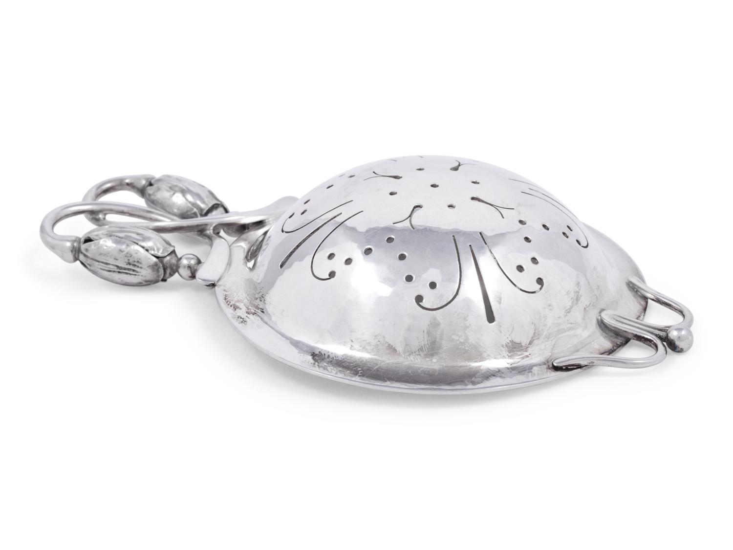 A Georg Jensen Silver Blossom Pattern Tea Strainer
