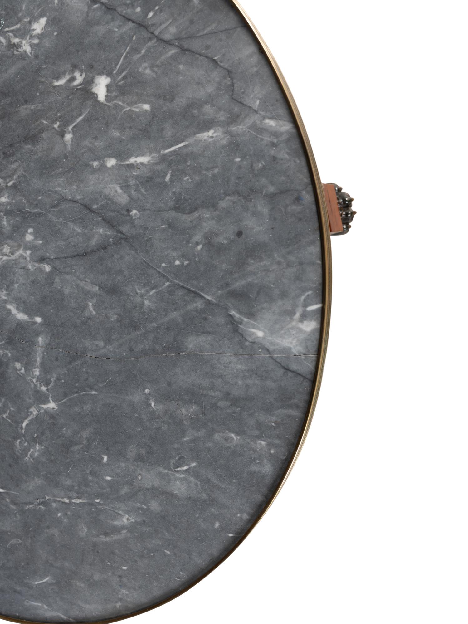 A Russian or Baltic Neoclassical Part-Ebonized Mahogany Marble-Top Center Table