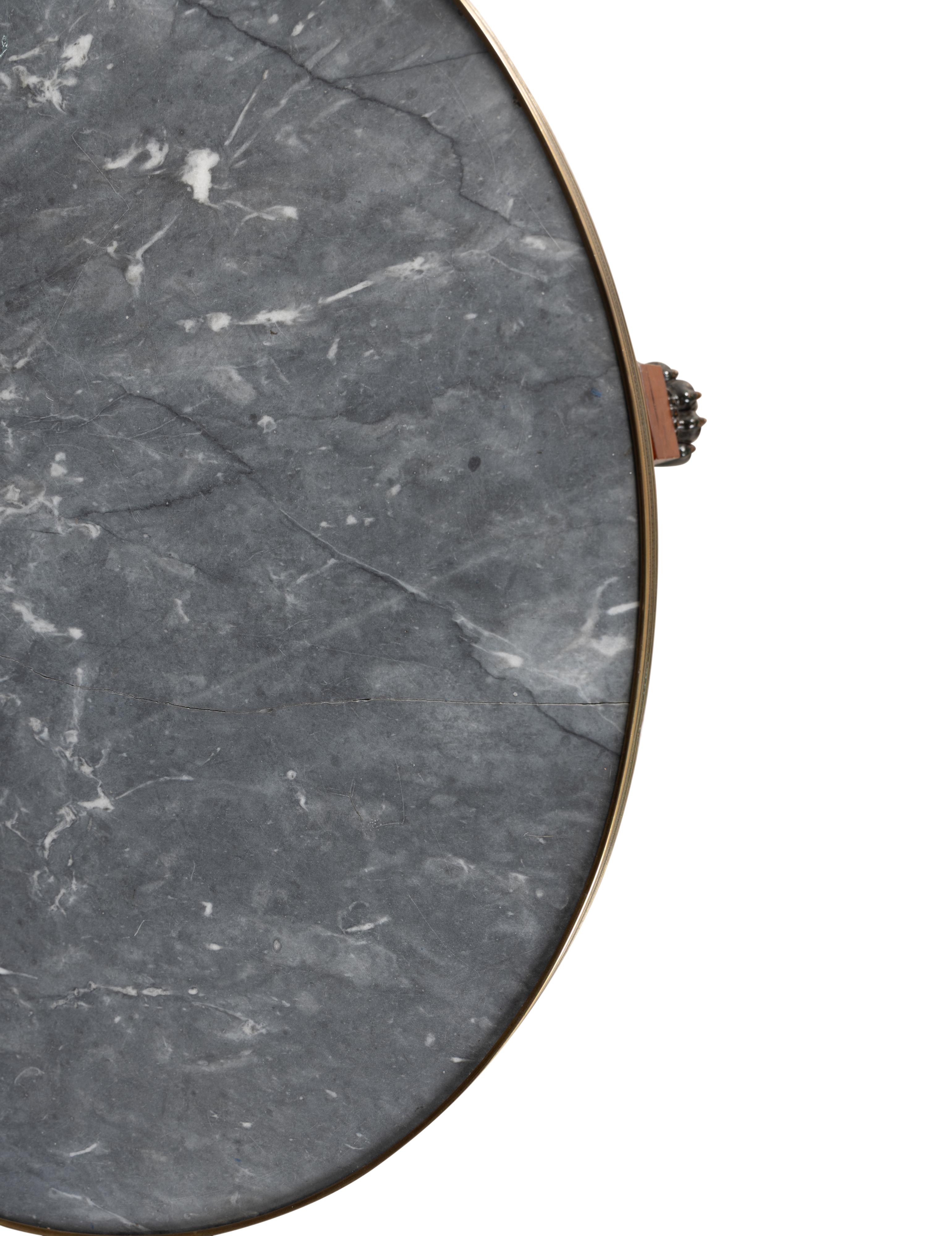 A Russian or Baltic Neoclassical Part-Ebonized Mahogany Marble-Top Center Table