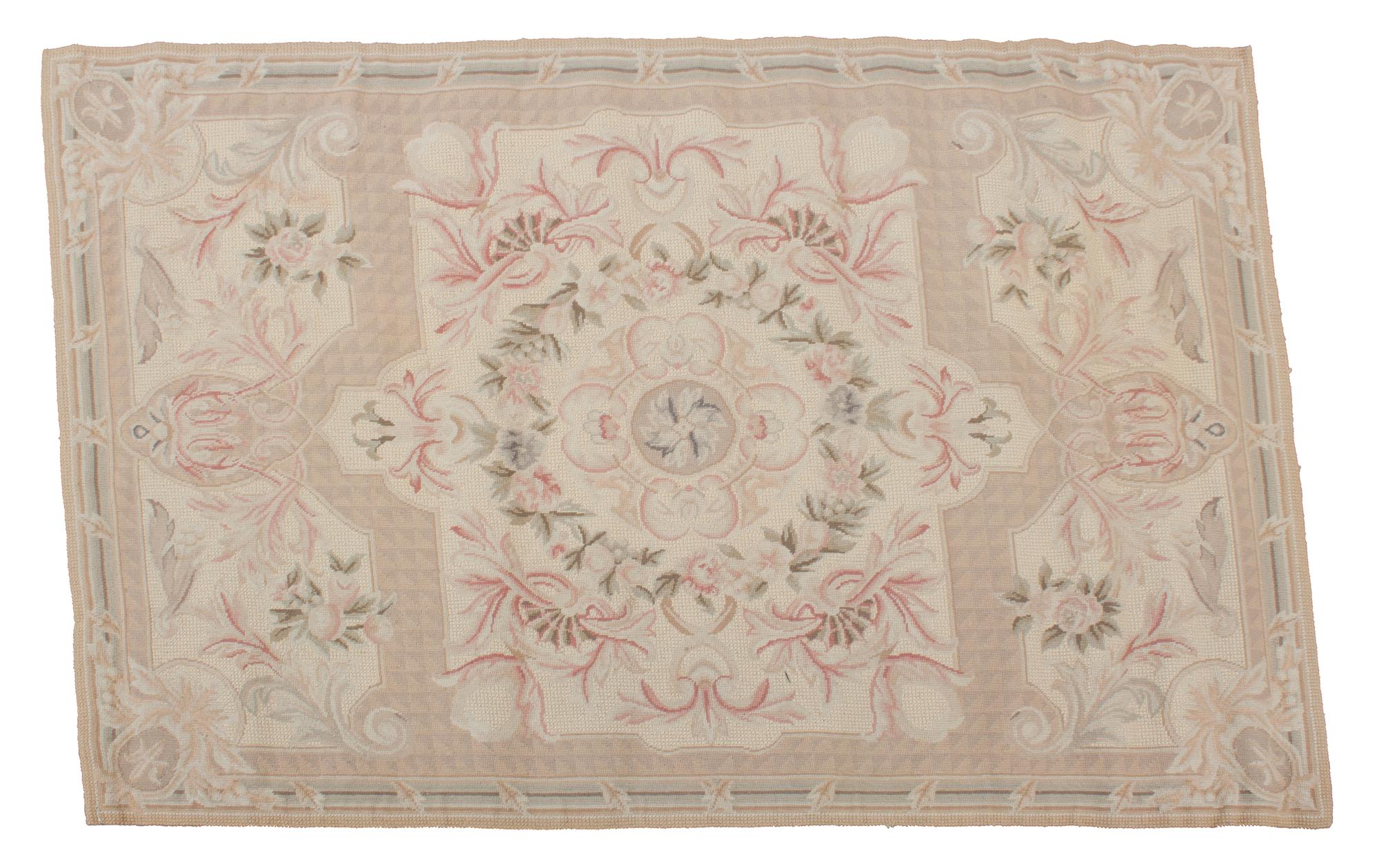 An Aubusson Style Needlepoint Rug 5 feet 8 inches x 3 feet 8 inches. — EARLY 20TH CENTURY