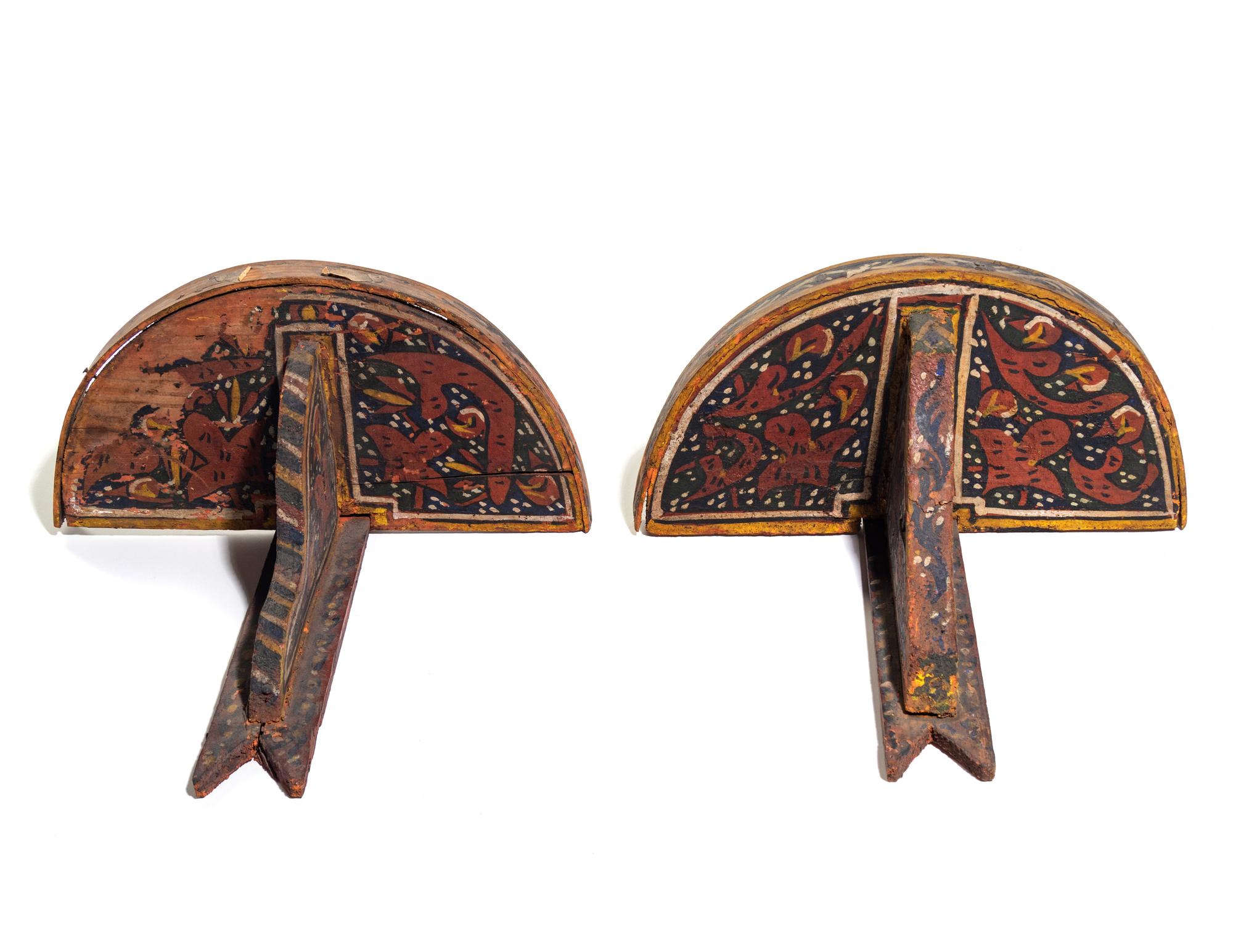 A Pair of Painted Wood Brackets
