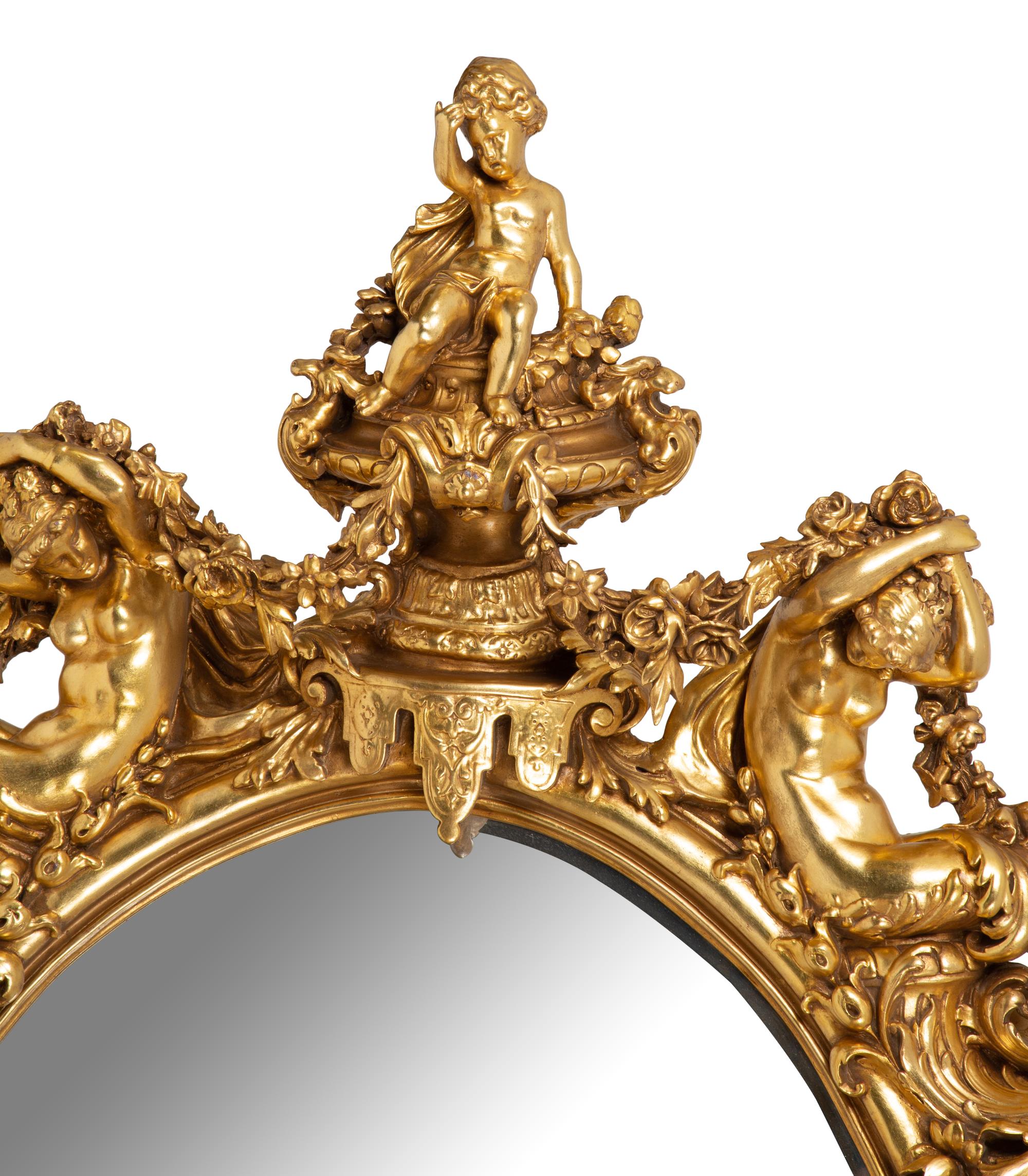 A Pair of Italian Baroque Carved Giltwood Oval Mirrors — 19TH CENTURY
