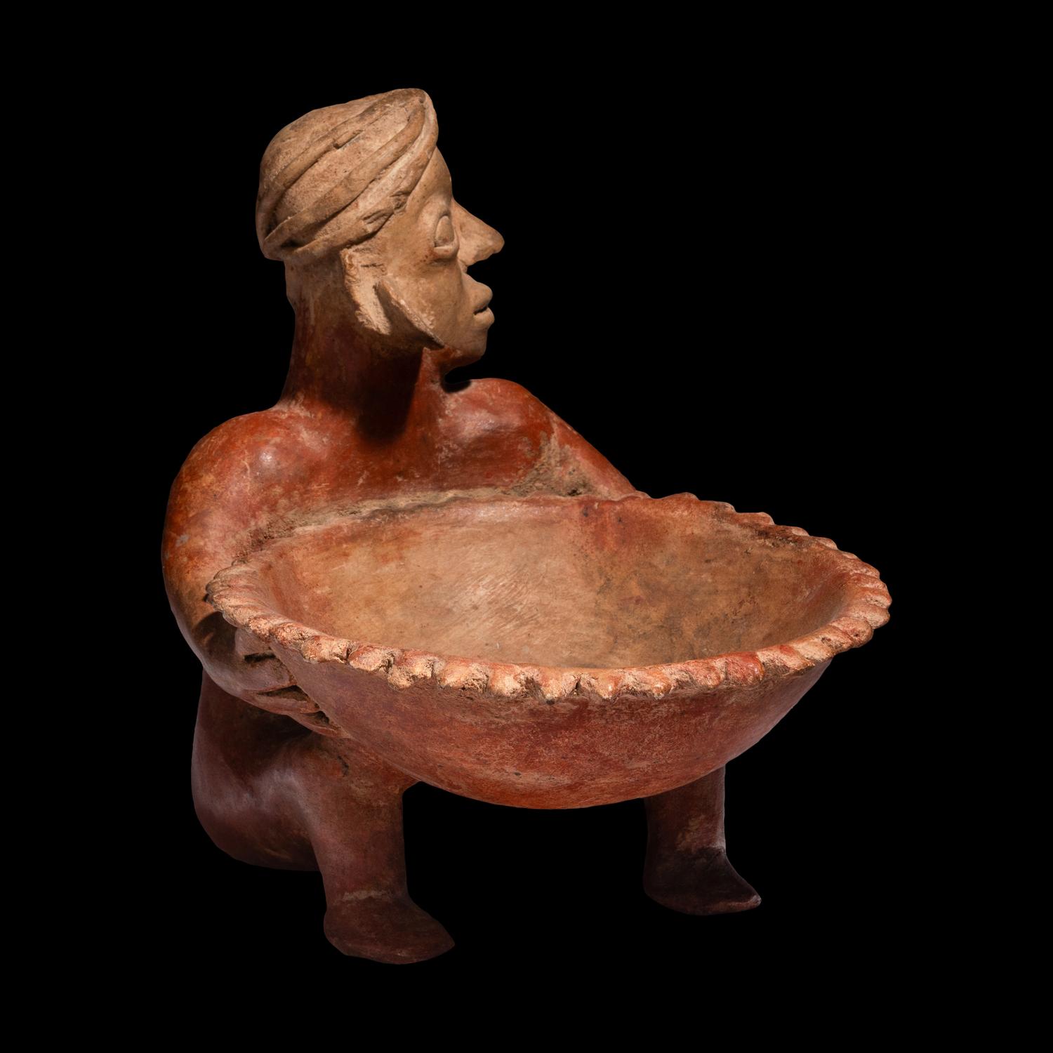 A Jalisco Seated Figure with Offering Bowl