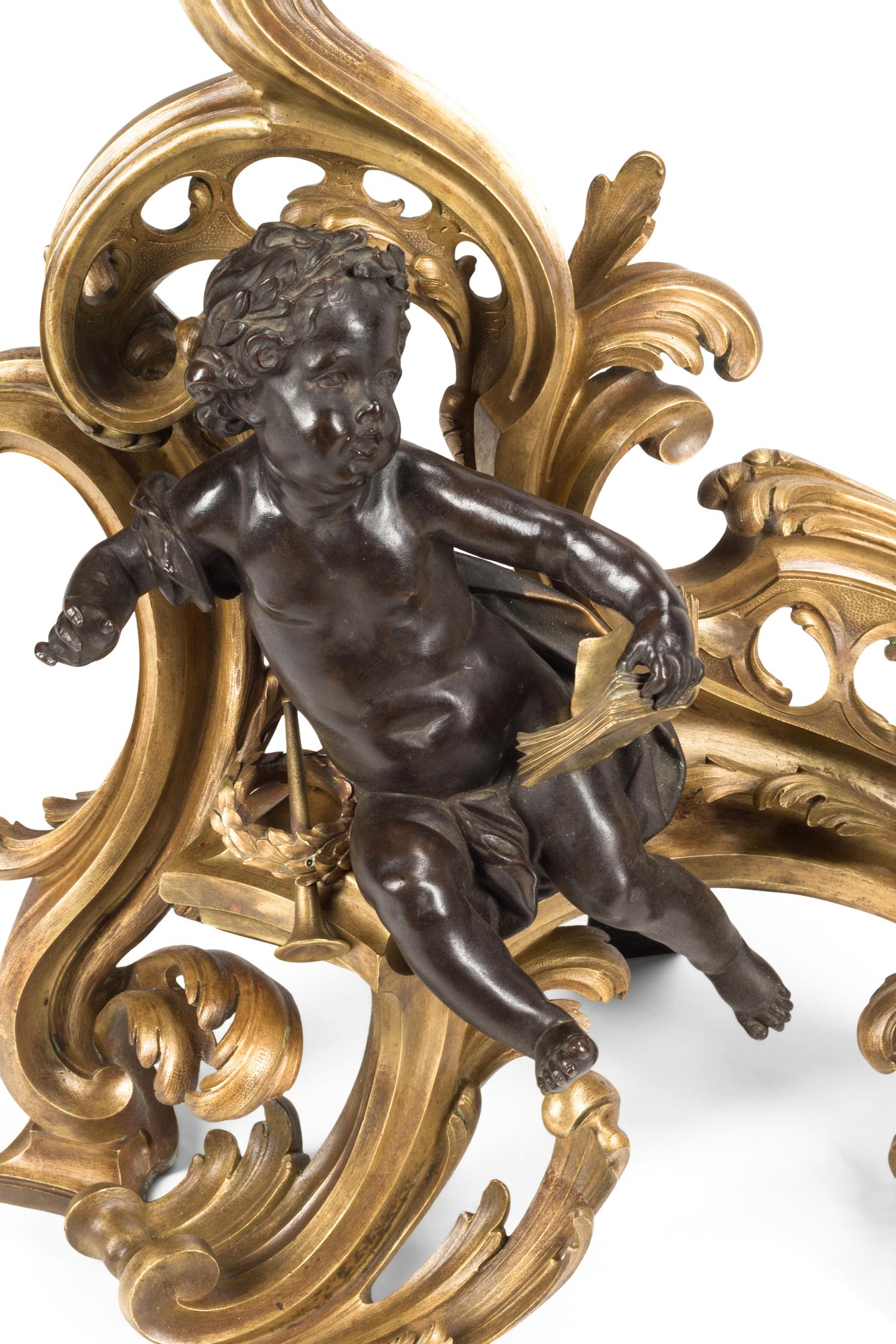 A Pair of Louis XV Style Gilt and Patinated Bronze Figural Chenets