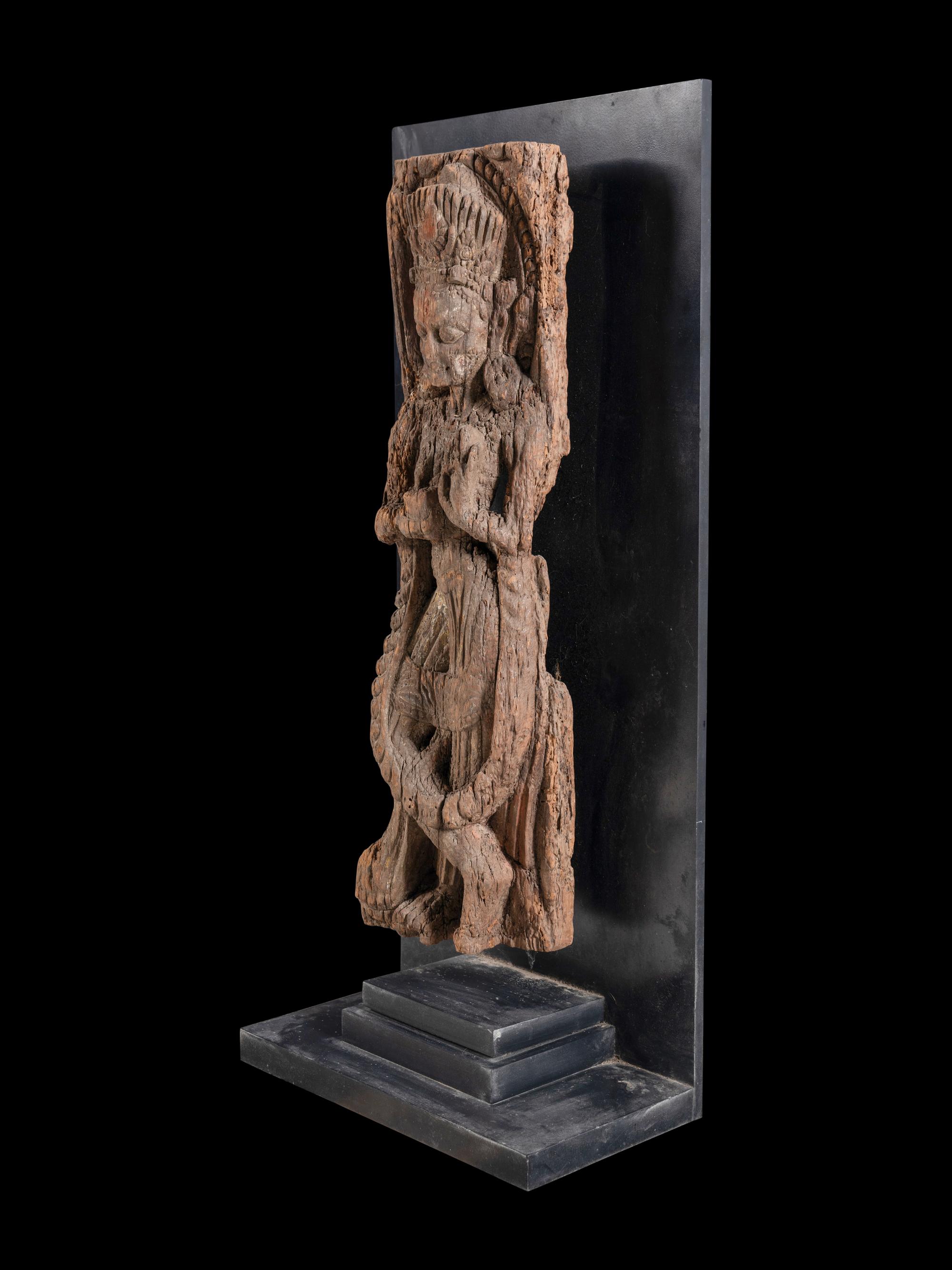 An Indian Carved Wood Figure of a Deity