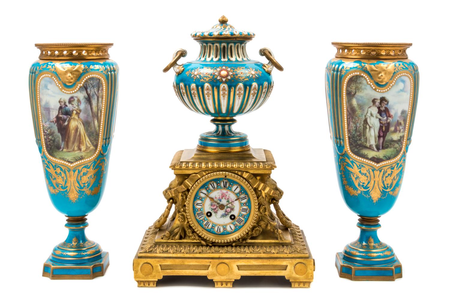 An Assembled French Gilt Bronze Mounted Porcelain Clock Garniture Height of clock 16 1/2 inches, height of vases 14 3/4 inches. — 19TH/20TH CENTURY