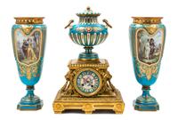 An Assembled French Gilt Bronze Mounted Porcelain Clock Garniture Height of clock 16 1/2 inches, height of vases 14 3/4 inches. — 19TH/20TH CENTURY