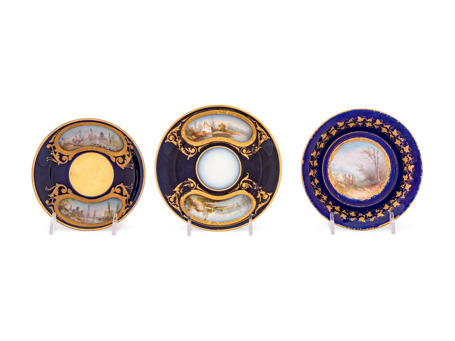 An Assembled Set of Six Sèvres Style Painted and Parcel Gilt Porcelain Teacups and Saucers