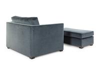 A Contemporary Velvet-Upholstered Armchair and Ottoman
