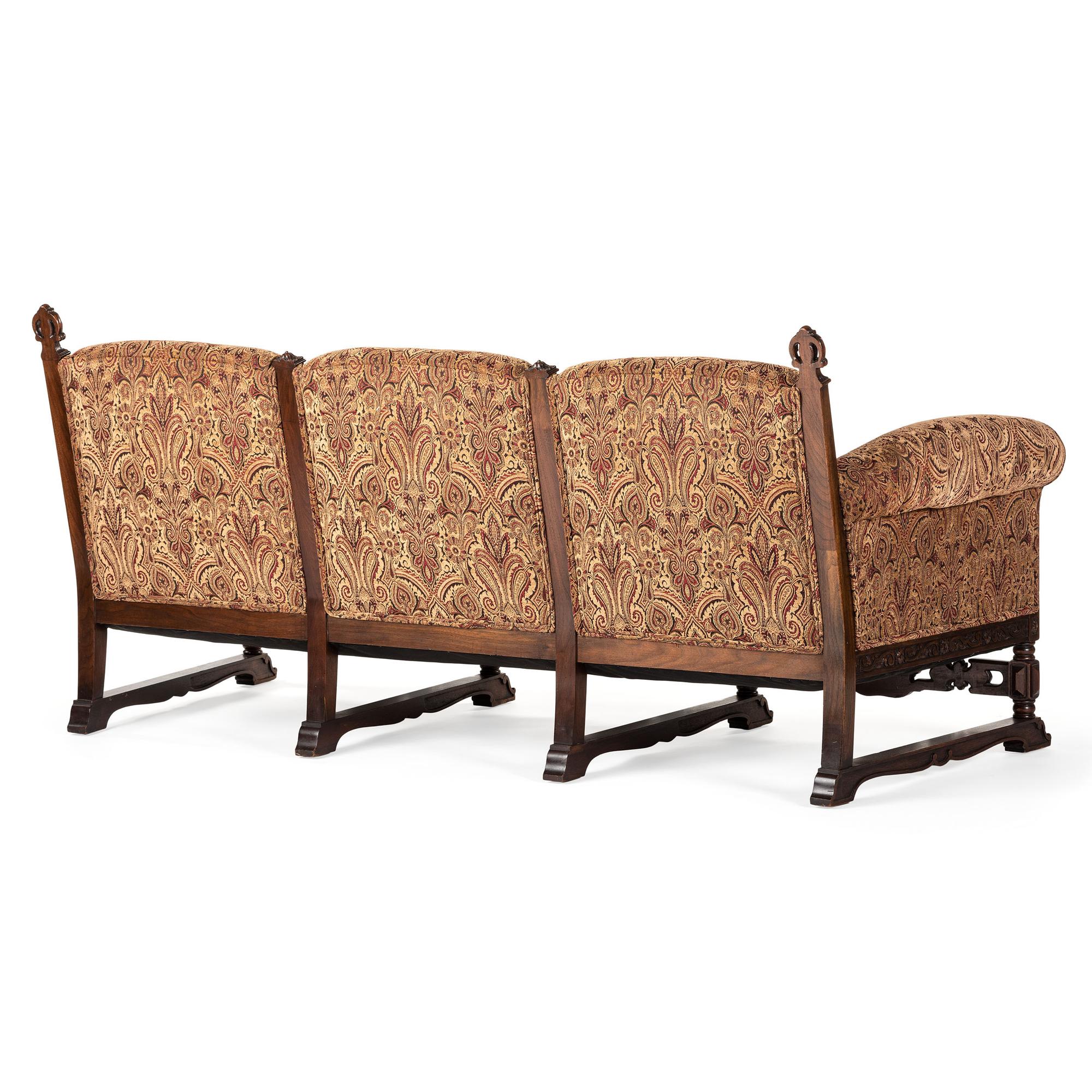 A Jacobean Style Carved Oak Sofa and Armchair