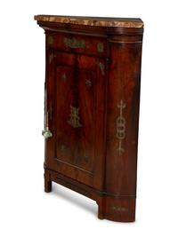 An Empire Gilt Bronze Mounted Mahogany Encoignure with a Brèche d'Alep Marble Top