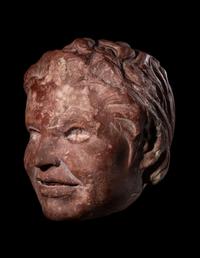 A Roman Rosso Antico Head of a Young Satyr