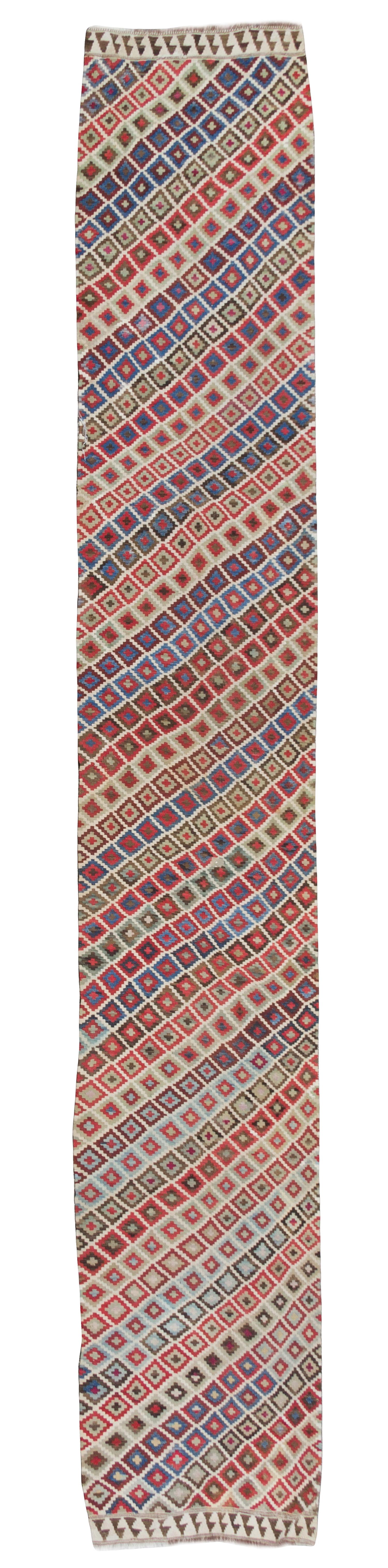 A Turkish Kilim Runner 16 feet 6 inches x 3 feet 1 1/2 inches.