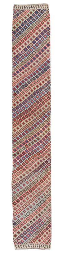 A Turkish Kilim Runner 16 feet 6 inches x 3 feet 1 1/2 inches.
