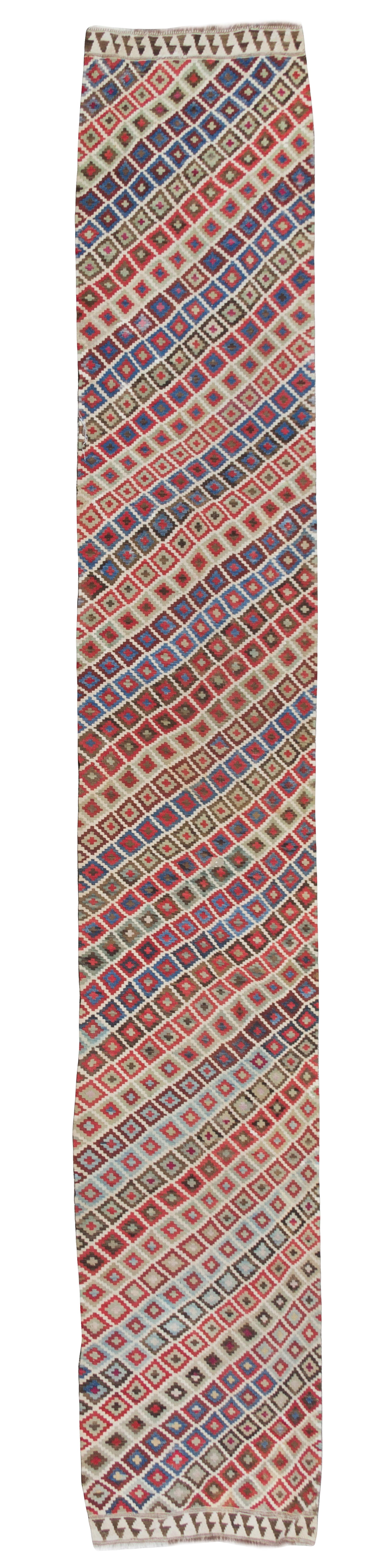A Turkish Kilim Runner 16 feet 6 inches x 3 feet 1 1/2 inches.