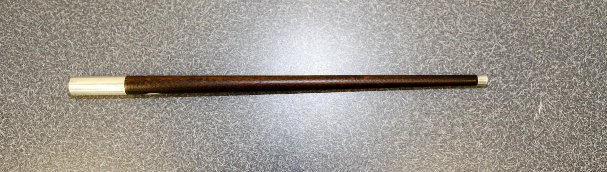 An American Silver-Mounted Walnut Jogging Stick, Reed & Barton, Taunton, MA,, having a silver ferrule with a tapering shaft, the sterli