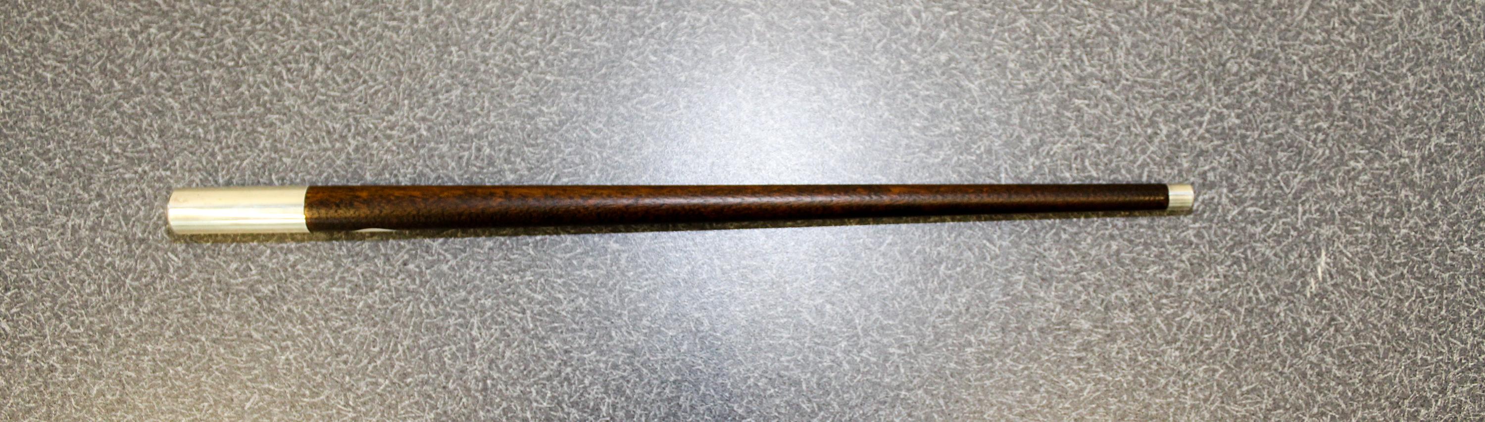 An American Silver-Mounted Walnut Jogging Stick, Reed & Barton, Taunton, MA,, having a silver ferrule with a tapering shaft, the sterli
