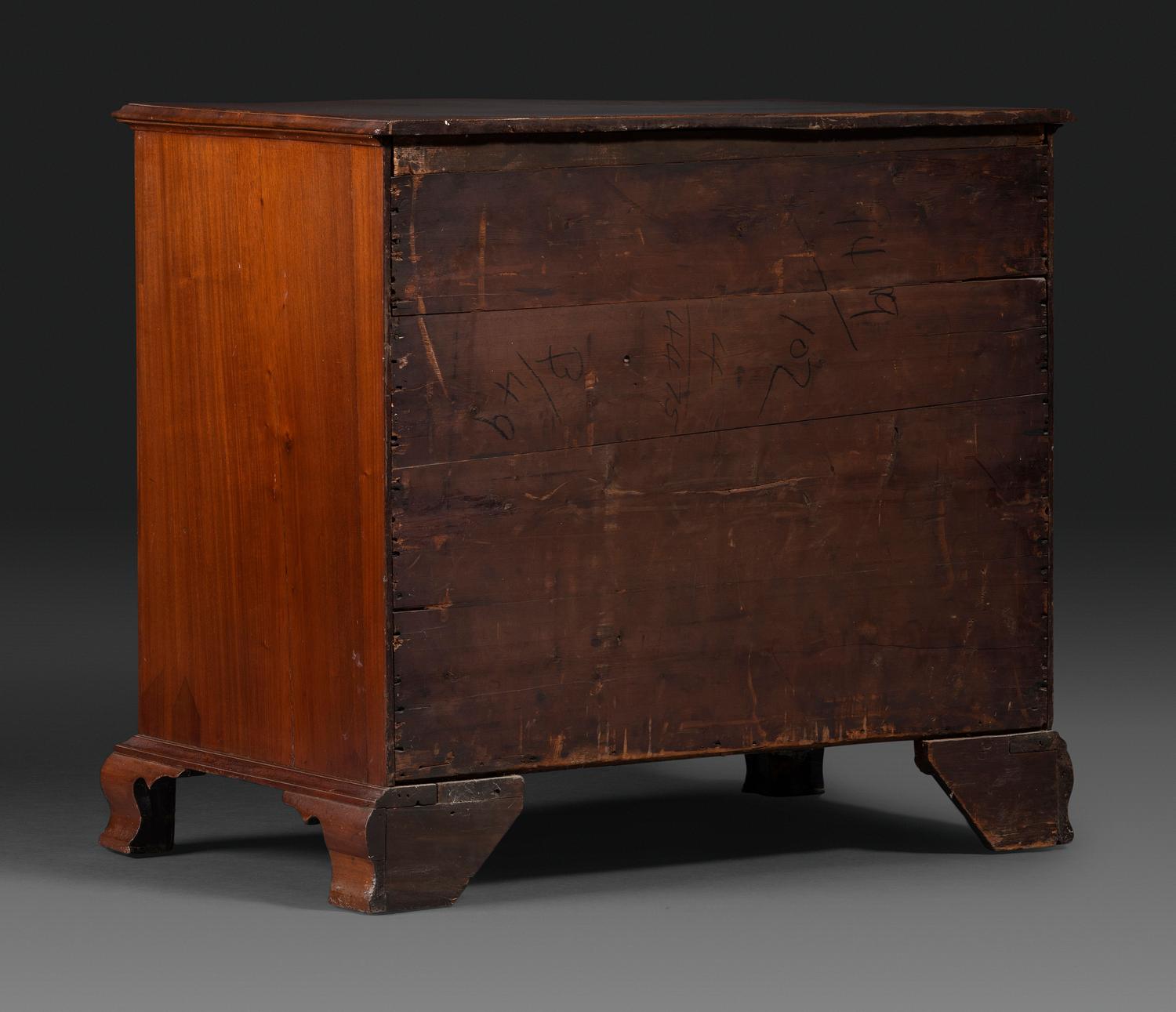A Chippendale Figured Mahogany Serpentine Chest of Drawers