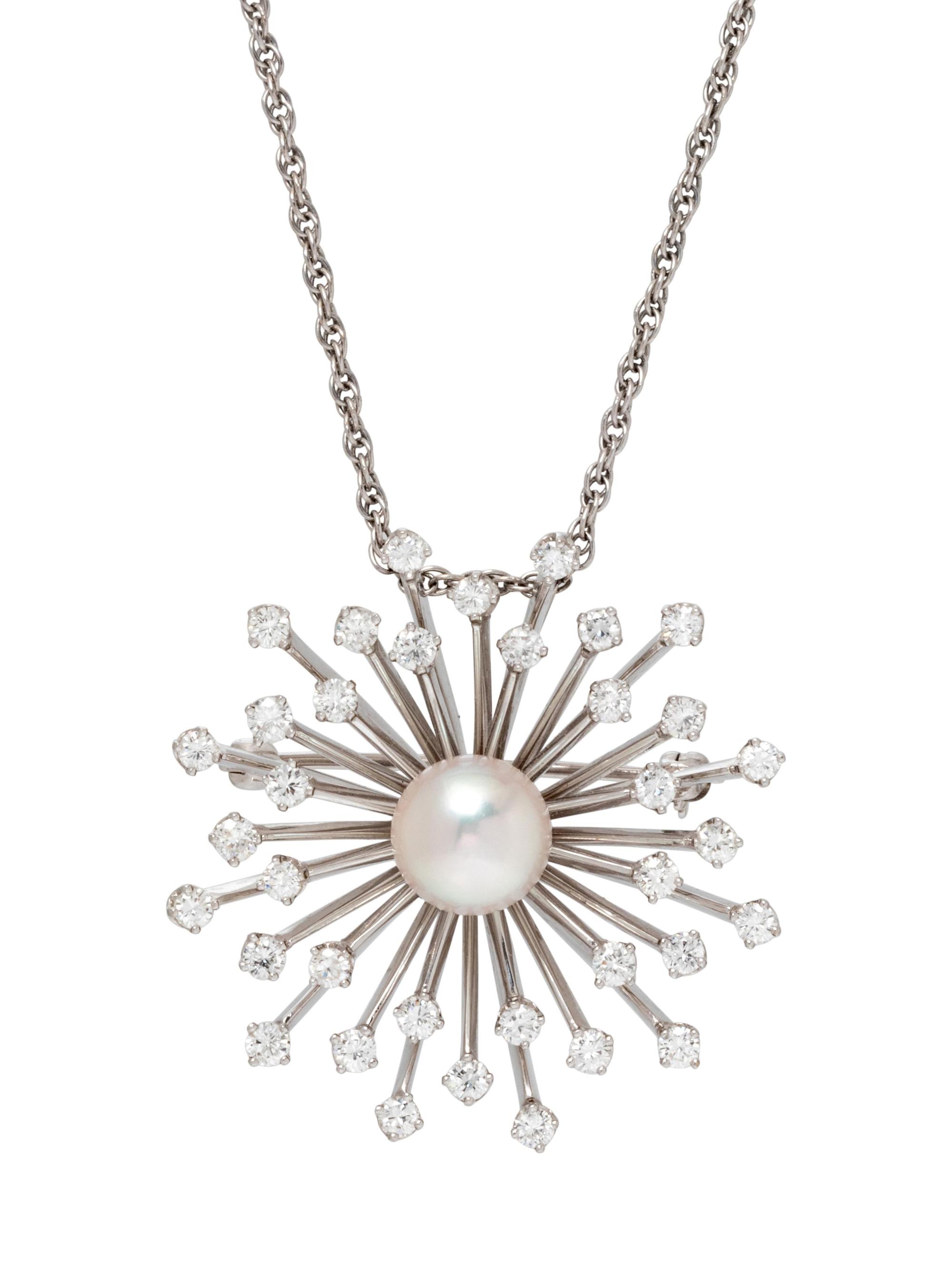 A White Gold, Cultured Pearl and Diamond Pendant/Brooch,