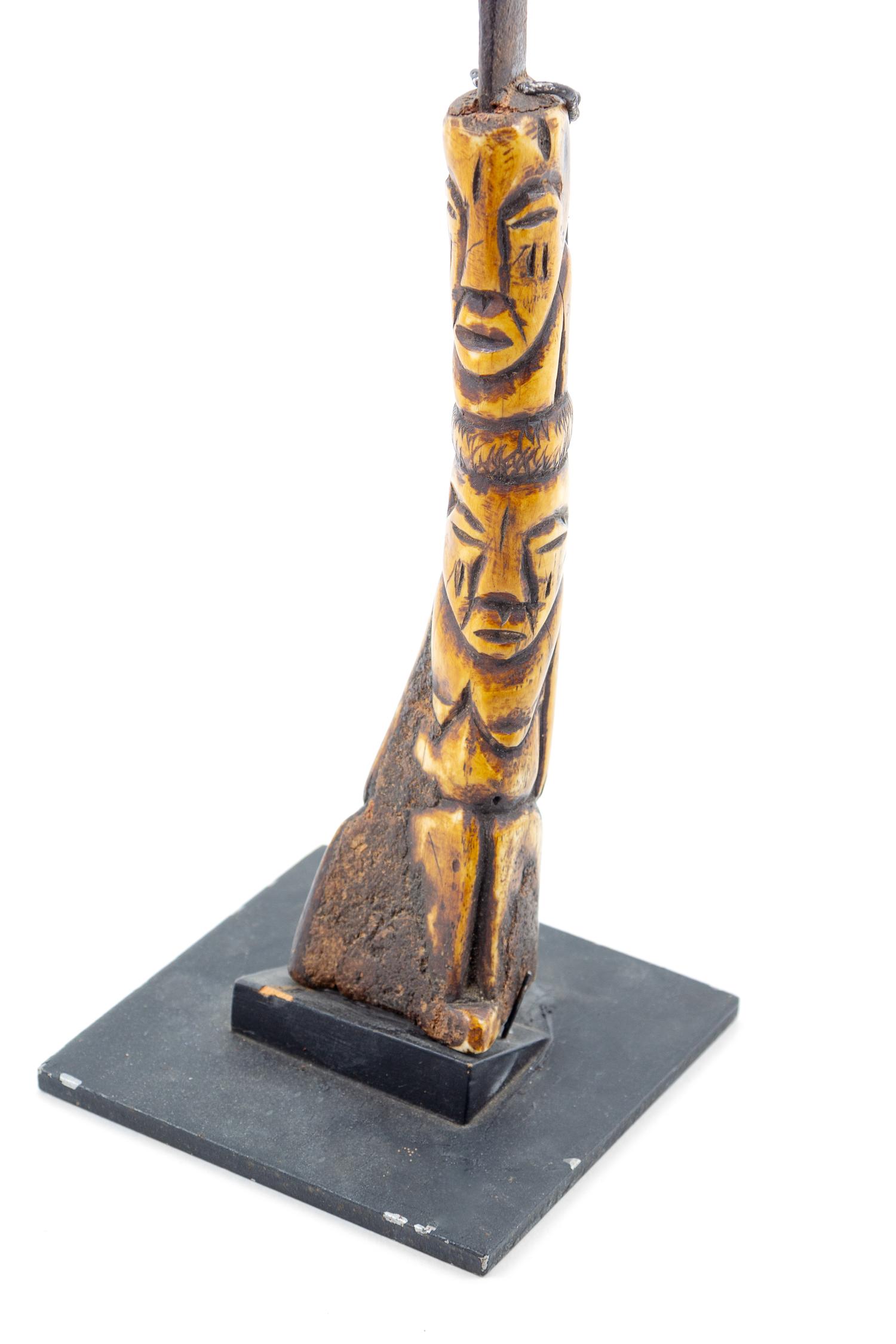 An African Carved Bone and Metal Knife Height 15 inches. — 20TH CENTURY