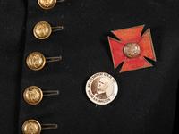 [CIVIL WAR]. GAR veteran's frock coat IDd to R.F. Woods with V Corps badge & Dept. of Iowa button.