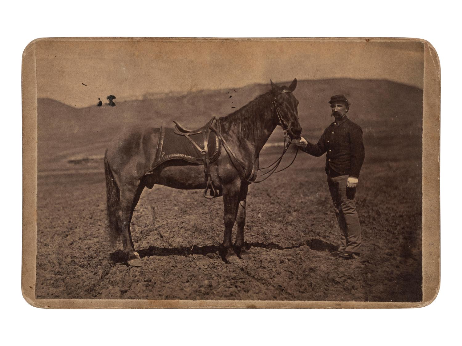[LATE INDIAN WARS]. GOFF, O.S. (1843-1916), photographer. Cabinet photograph of Comanche, sole survivor of the Battle of Little Bighorn. Bismarck, Dakota Territory.