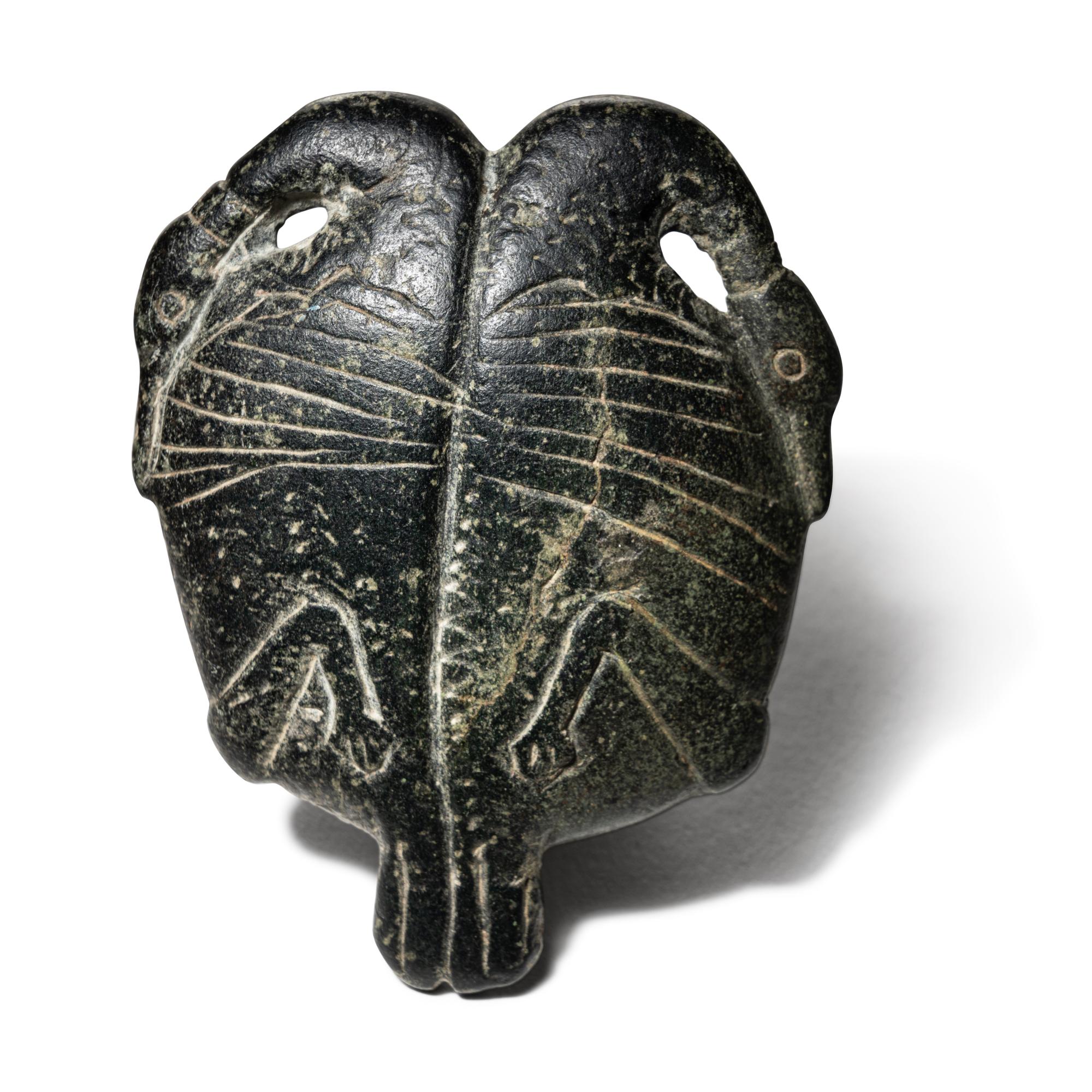 An Egyptian Steatite Cosmetic Palette in the Form of a Double Duck