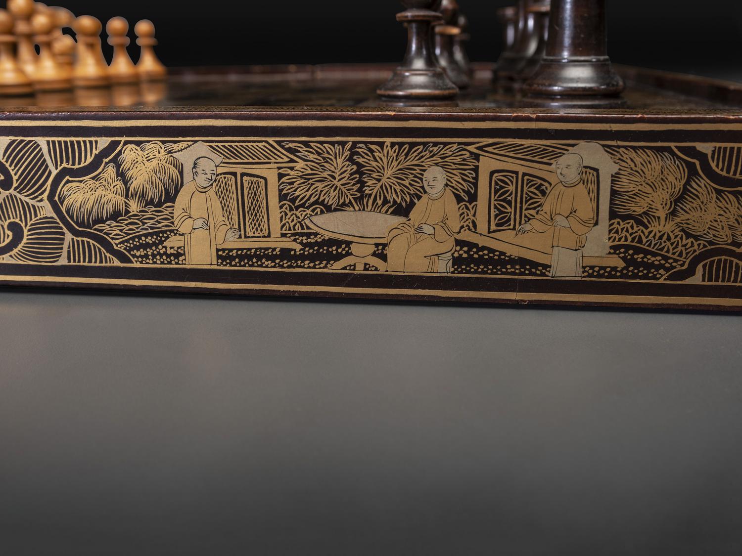 A Chinese Export Gilt Decorated Black Lacquer Folding Game Board