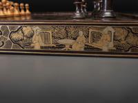 A Chinese Export Gilt Decorated Black Lacquer Folding Game Board