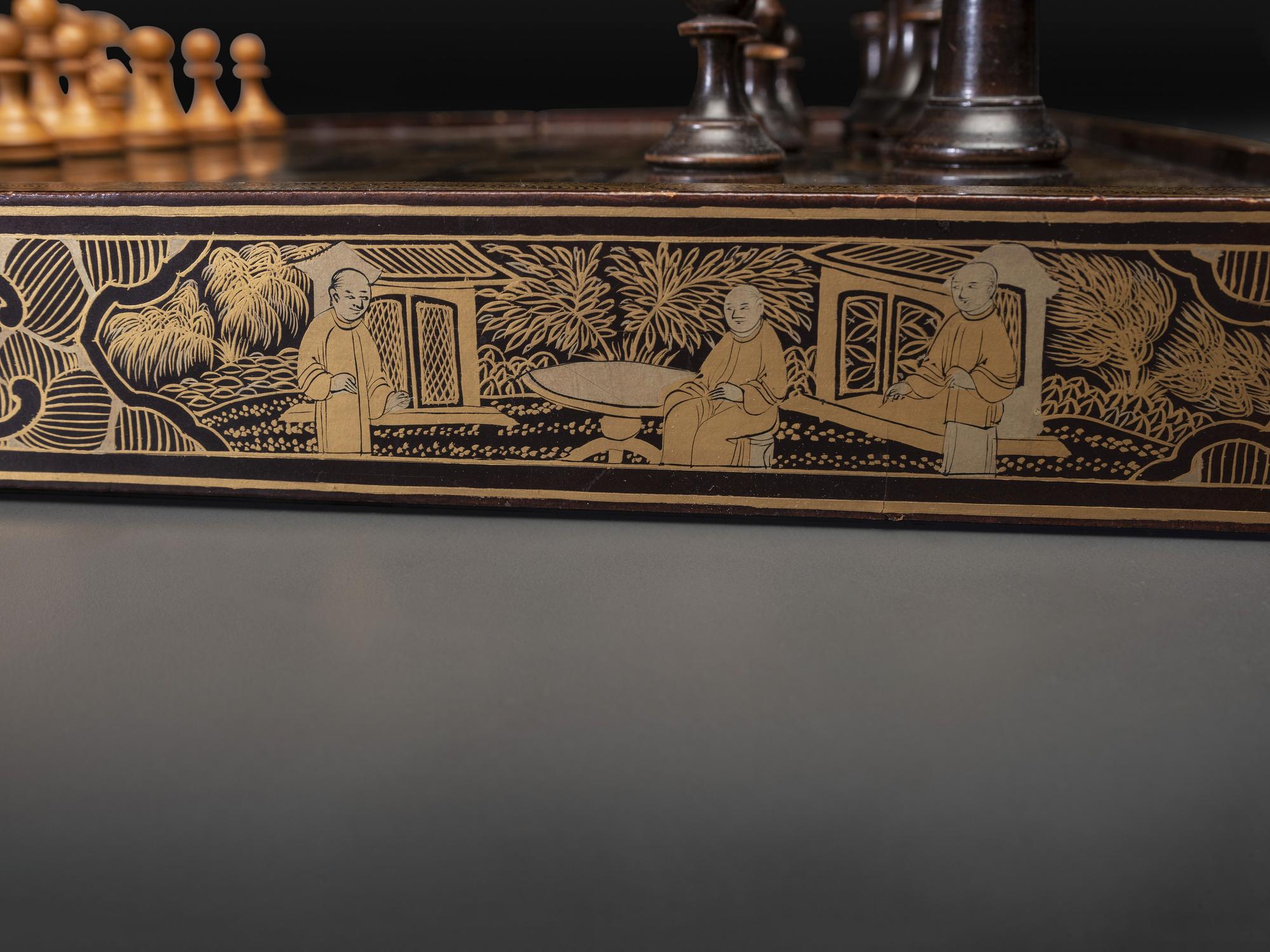 A Chinese Export Gilt Decorated Black Lacquer Folding Game Board