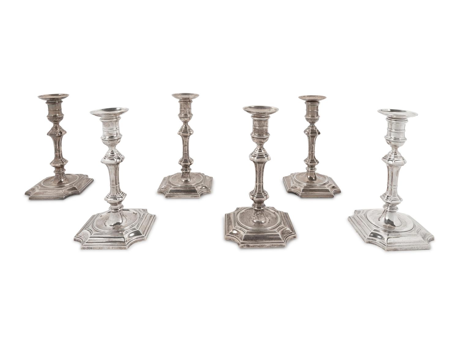 A Set of Four English Silver Candlesticks