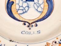 A Dutch Glazed Earthenware Armorial Charger