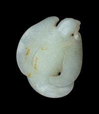 A Carved White Jade Figure of a Parrot