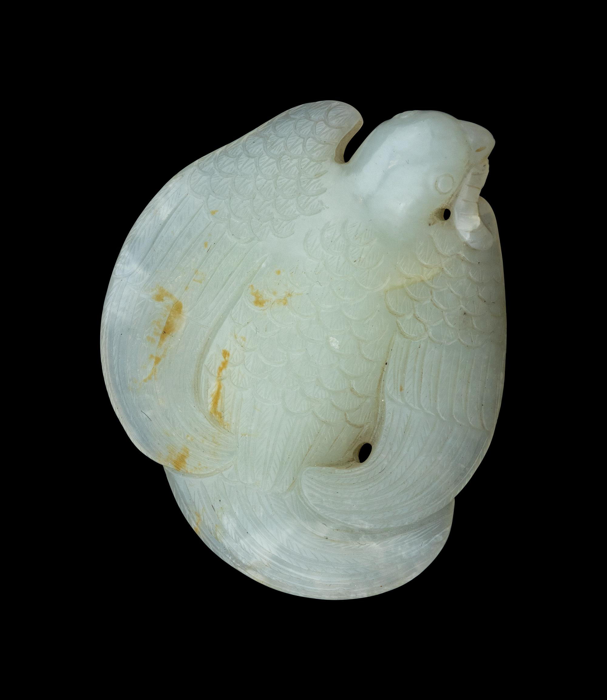 A Carved White Jade Figure of a Parrot