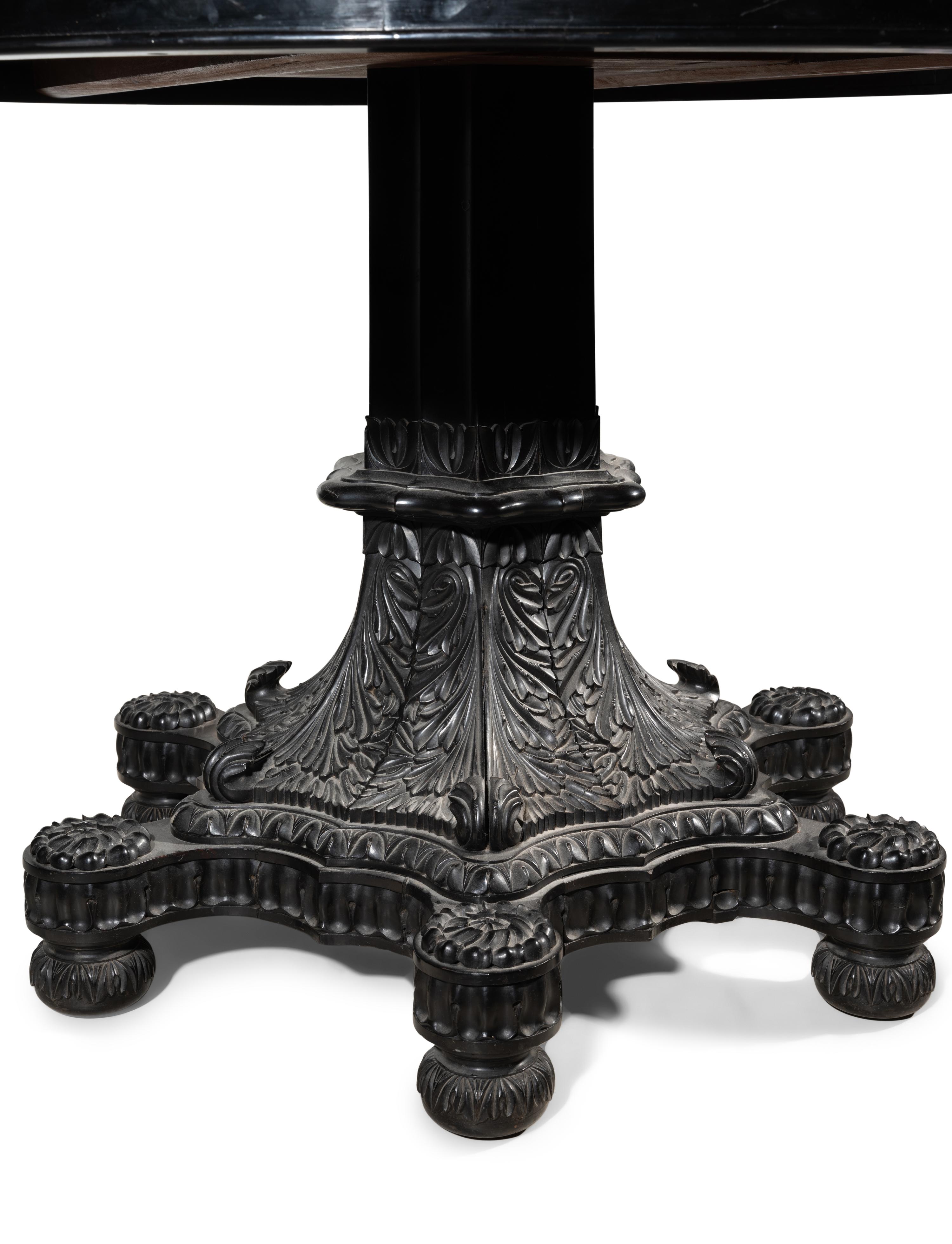An Anglo-Colonial Carved and Specimen Woods Inlaid Tilt-Top Breakfast Table