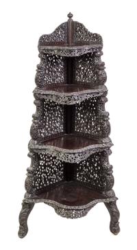 An Anglo-Indian Carved Hardwood Corner Etagere Height 58 1/2 x width 19 x depth 19 inches. — LATE 19TH/EARLY 20TH CENTURY