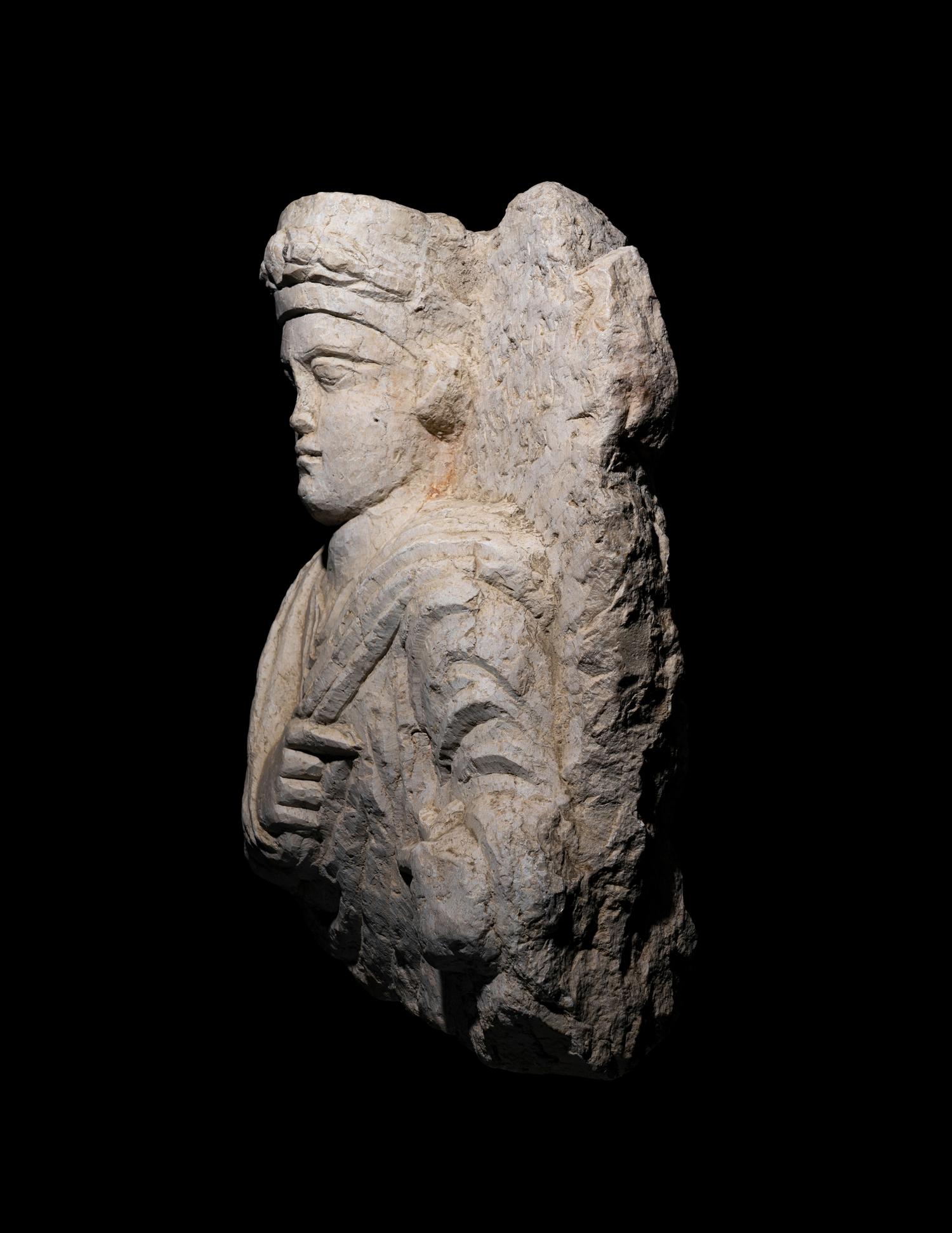 A Palmyrene Limestone Bust of a Priest