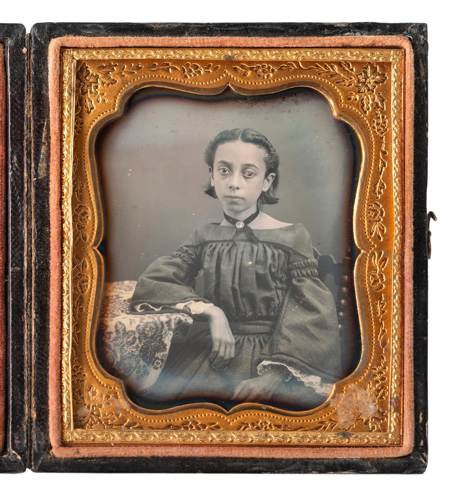 [EARLY PHOTOGRAPHY]. Sixth plate daguerreotype portrait of a young mixed race girl.