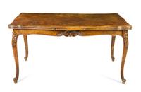 A French Provincial Draw Leaf Table Height 30 x width 59 x depth 39 inches (closed). — 19TH/20TH CENTURY