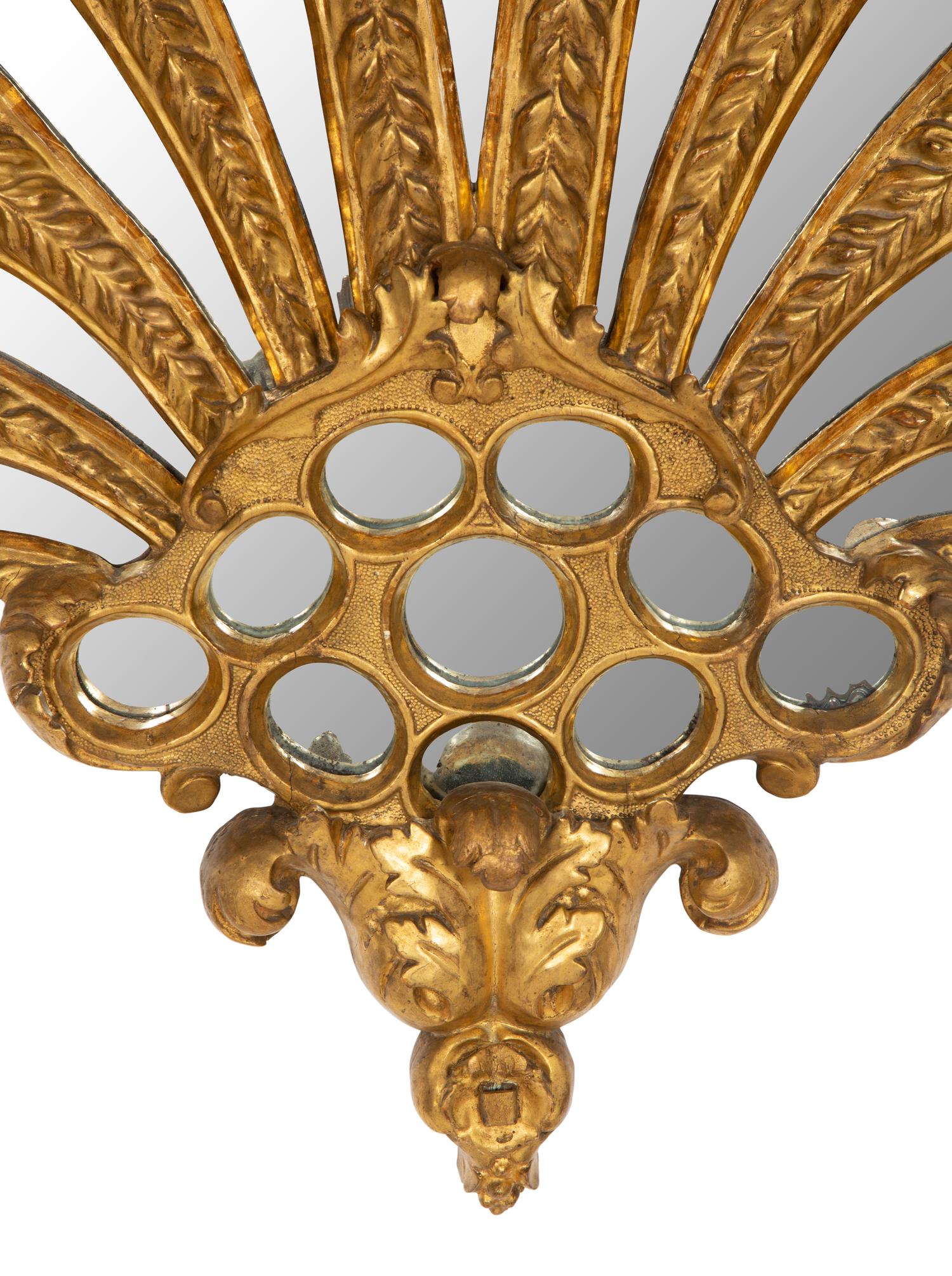 An Italian Giltwood Plume-Form Mirror