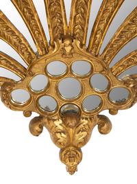 An Italian Giltwood Plume-Form Mirror
